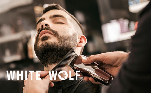 Скидка на Скидка до 53% на классическую и стрижку машинкой, оформление и бритье бороды, комплекс «Отец и сын» в сети барбершопов White Wolf